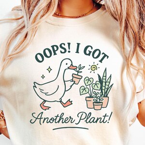 Oops I Got Another Plant Goose T Shirt, Funny Vintage Woman Shirt, Garden Club Tee, Garden Humor, Shirts For Gardening Moms, Goose Tshirt, Oops I Got Another Plant Tshirt, Cute Plant Nana Gift, Plant Lover Gift, Funny Goose Shirt, Gift For Gardener Mom, Plant Shirt, Goose Meme, chaos gardening shirt,garden gangster t shirts,keep calm and garden on,funny tee garden,funny gardener shirt men,funny hoe garden shirt,fun gardening t shirt,dirty hoes tshirt vneck,where my hoes at shirt