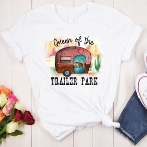 May include: White t-shirt with a graphic of a vintage camper and the text "Queen of the Trailer Park".