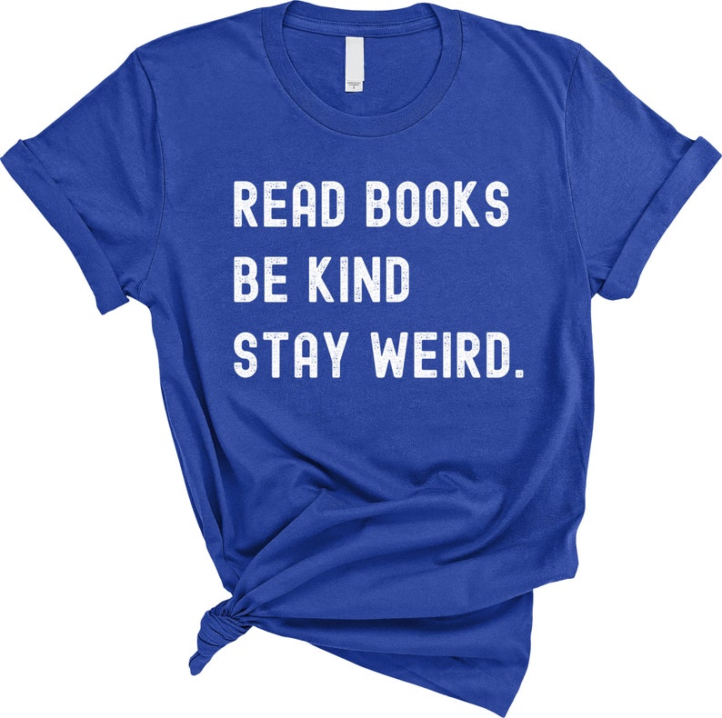 May include: Royal blue t-shirt with white text that reads "Read Books Be Kind Stay Weird."