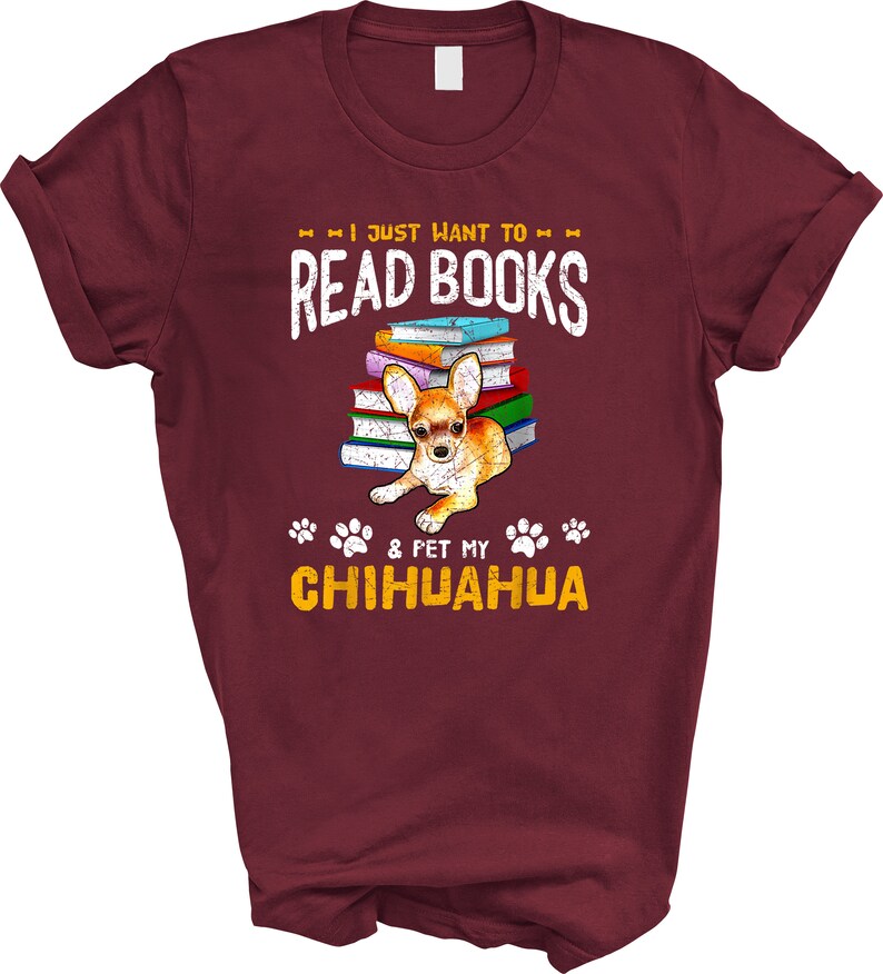 May include: Burgundy t-shirt with a distressed graphic design that says "I just want to read books & pet my chihuahua". The graphic also features a chihuahua sitting on a stack of colorful books.