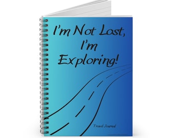 May include: Spiral-bound travel journal with a blue gradient cover. The cover features the text "I'm Not Lost, I'm Exploring!" and a black road illustration. The words "Travel Journal" are at the bottom.