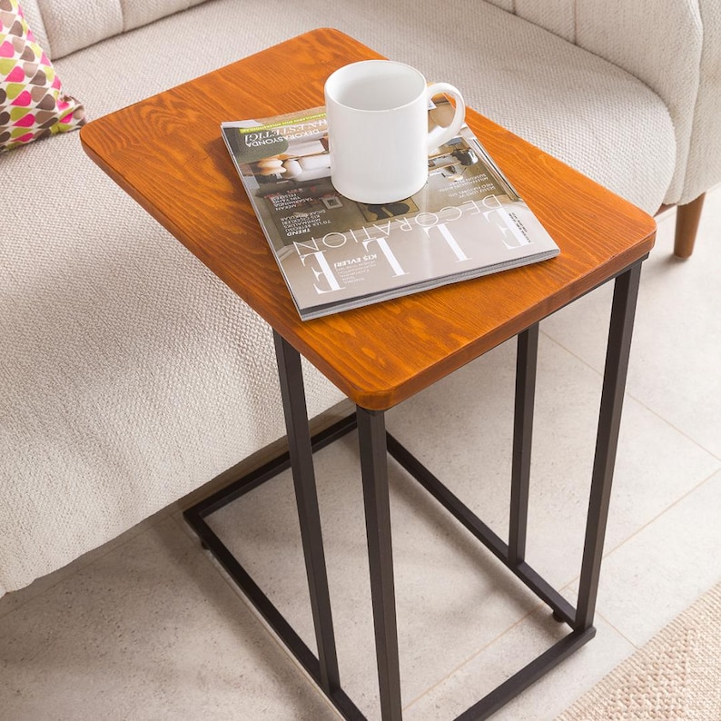 🪵 C-Shaped Side End Table for Narrow Spaces – Solid Pine Wood with Minimalist Metal Legs

Looking for a compact, modern, and elegant solution for tight spaces? This C shape end table is designed to slide effortlessly under your sofa or chair, offering convenience and functionality without taking up much room.

Its slim profile makes it the ideal side table for couch, especially in narrow places like small apartments, studios, or minimalist interiors.