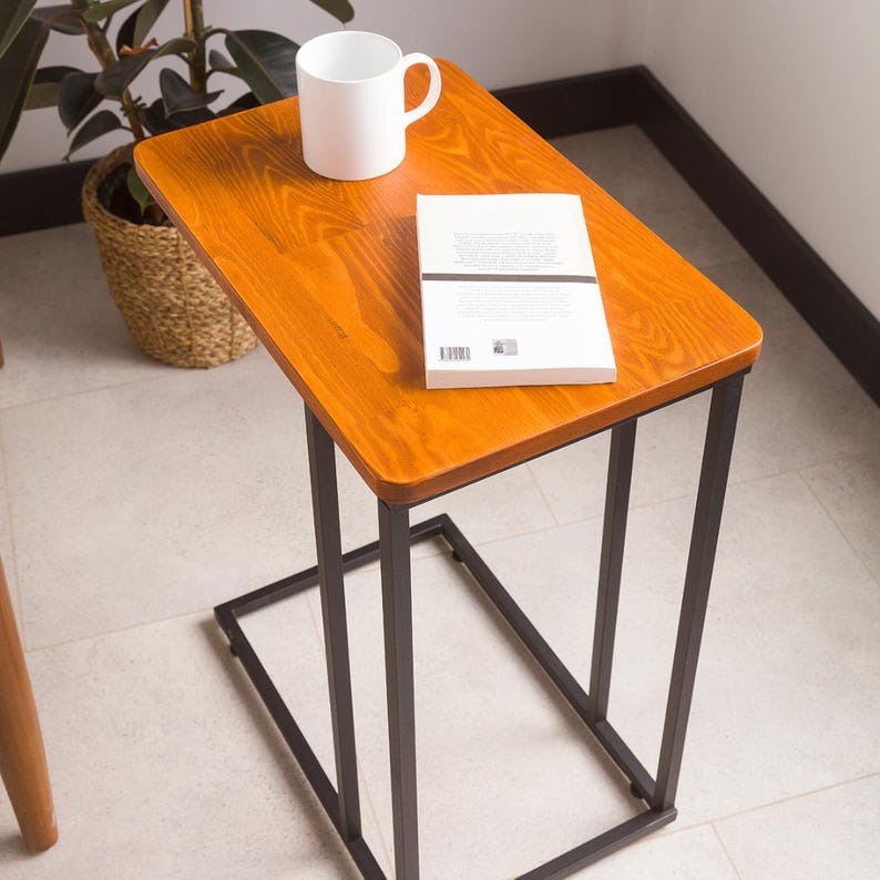🪵 C-Shaped Side End Table for Narrow Spaces – Solid Pine Wood with Minimalist Metal Legs

Looking for a compact, modern, and elegant solution for tight spaces? This C shape end table is designed to slide effortlessly under your sofa or chair, offering convenience and functionality without taking up much room.

Its slim profile makes it the ideal side table for couch, especially in narrow places like small apartments, studios, or minimalist interiors.