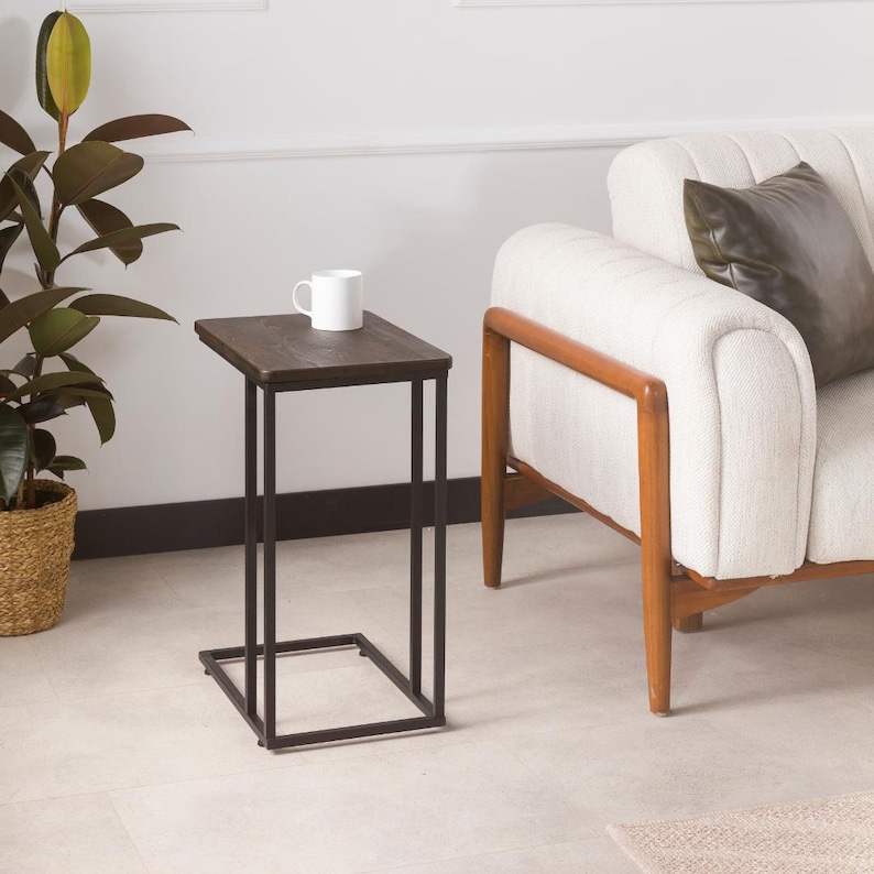 🪵 C-Shaped Side End Table for Narrow Spaces – Solid Pine Wood with Minimalist Metal Legs

Looking for a compact, modern, and elegant solution for tight spaces? This C shape end table is designed to slide effortlessly under your sofa or chair, offering convenience and functionality without taking up much room.

Its slim profile makes it the ideal side table for couch, especially in narrow places like small apartments, studios, or minimalist interiors.