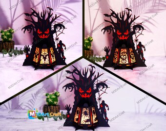 May include: A black and red Halloween-themed papercraft lamp with a spooky tree design. The tree has a scary face and outstretched arms. The lamp is lit from within, casting a warm glow.