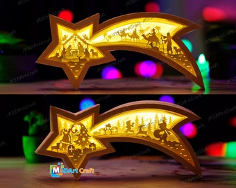 May include: A white wooden star-shaped ornament with a cut-out design depicting the nativity scene and the three wise men following a star. The ornament is illuminated from behind, creating a warm glow.