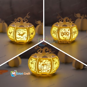 May include: Three papercraft pumpkin lanterns with intricate cutouts. The first pumpkin has a bat and spiderweb design, the second has the word "Boo" and spiderwebs, and the third has a pumpkin design. The lanterns are illuminated from within, casting a warm glow.