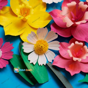 May include: A collection of colorful paper flowers in shades of yellow, pink, and white, with green leaves, arranged on a blue background. The flowers have detailed petal designs and are labeled with "M3DArt Craft".