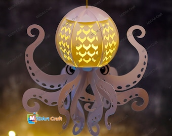 May include: A white papercraft octopus with a glowing, round, patterned lampshade for a head. The octopus has eight tentacles with intricate details. The lampshade has a pattern of hearts and scales. The octopus is hanging from the ceiling.