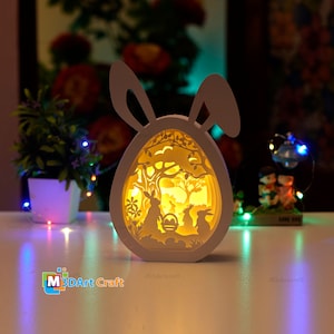 Caja de sombras SVG de huevos de Pascua de la familia de conejos para proyectos de Cricut - Linterna de papel de Pascua - Caja de luz de huevos de conejito de Pascua - papel en capas 3D svg