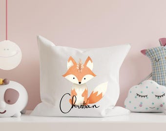 May include: White pillow with an orange fox illustration and the name "Christian" written in black cursive.