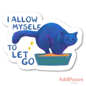 May include: A sticker featuring a blue cat in a litter box with the text "I ALLOW MYSELF TO LET GO". The cat is depicted with a relaxed expression, and there are two yellow starbursts.