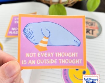 May include: A rectangular sticker with a light purple background and an orange border. It features a light blue seal wearing an orange and white traffic cone on its head. The text reads: NOT EVERY THOUGHT IS AN OUTSIDE THOUGHT in white letters.