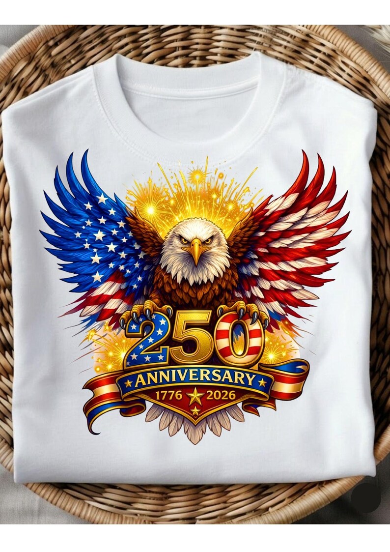 May include: White t-shirt with a graphic of an American bald eagle, wings in red, white, and blue. The design includes the text "250 Anniversary 1776-2026" on a banner, celebrating a milestone.