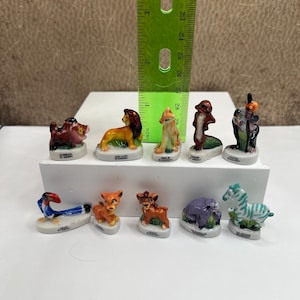 May include: A set of three ceramic mugs with a speckled, matte finish. The mugs are in shades of cream, light gray, and dark gray. Each mug has a simple, minimalist design, perfect for coffee or tea.