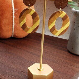 Fall colored oval dangles with wood hardware. Handmade polymer clay. Autumn. Sweater weather. Stripes.