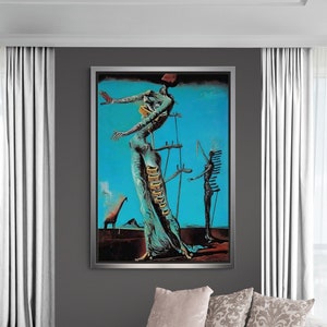 May include: A framed surrealist painting with a blue sky background and figures in a desert landscape. The artwork features a woman-like figure with a long dress and a giraffe on fire. The painting is displayed in a modern living room.
