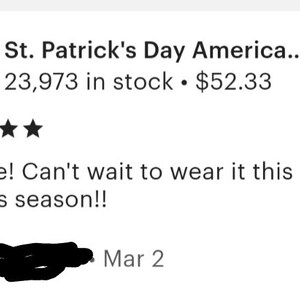 May include: A black hoodie with a green shamrock and the text "St. Patrick's Day America..." printed on the back. The hoodie is being worn by a person in the image. The image also includes a five-star rating and the text "So cute! Can't wait to wear it this St. Paddy's season!!"  The text "Ari E... Mar 2" is also included in the image.