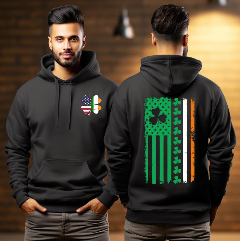 May include: Black hooded sweatshirt with a green shamrock and an American flag on the front and a green, white, and orange flag with shamrocks on the back.