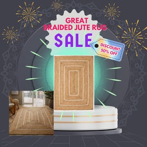 May include: A rectangular braided jute rug with a white border is displayed on a white platform. The image includes the text "GREAT BRAIDED JUTE RUG SALE" and a "DISCOUNT 50% OFF" tag. The rug is a natural tan color.