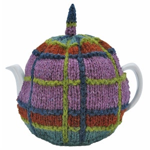 Heathland Heights. Handknitted and lined tea cosy with crocheted detail. Made with wool, alpaca and viscose.