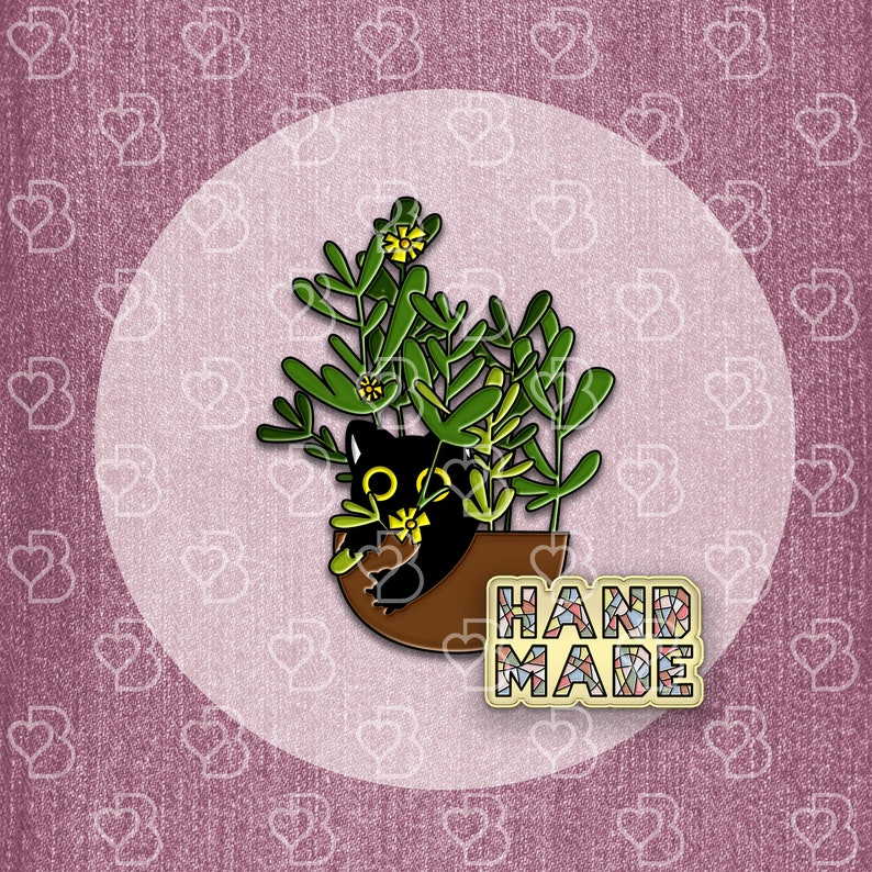 May include: Black cat peeking out of a brown pot with green plants and yellow flowers. The pot has the word "HANDMADE" written on it in colorful mosaic tiles.
