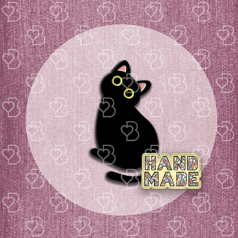 May include: Black cat pin with yellow eyes and the word "HANDMADE" in colorful mosaic letters.