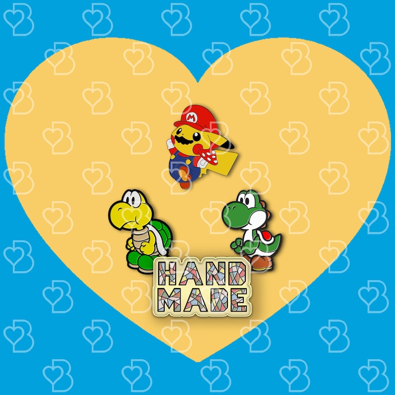 K&ouml;nnte beinhalten: Drei Emaille-Pins mit Figuren aus der Super Mario Bros. Videospielserie. Die Pins sind gelb, gr&uuml;n und rot. Die Pins befinden sich auf einem gelben Hintergrund mit einem Herzmuster. Der Text "HANDMADE" befindet sich in der Mitte des Bildes.