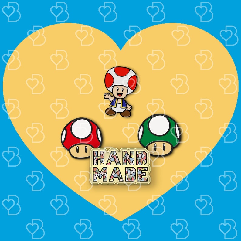 K&ouml;nnte beinhalten: Drei handgefertigte Emaille-Pins mit Figuren aus der Super Mario Bros. Videospielserie. Die Pins sind in Form eines roten und wei&szlig;en Pilzes, eines gr&uuml;nen und wei&szlig;en Pilzes und einer roten und blauen Pilzfigur mit einem blauen und wei&szlig;en Hut. Die Pins befinden sich auf einem gelben Hintergrund mit einem Herzmuster und dem Wort "HANDMADE" in bunten Mosaikfliesen.