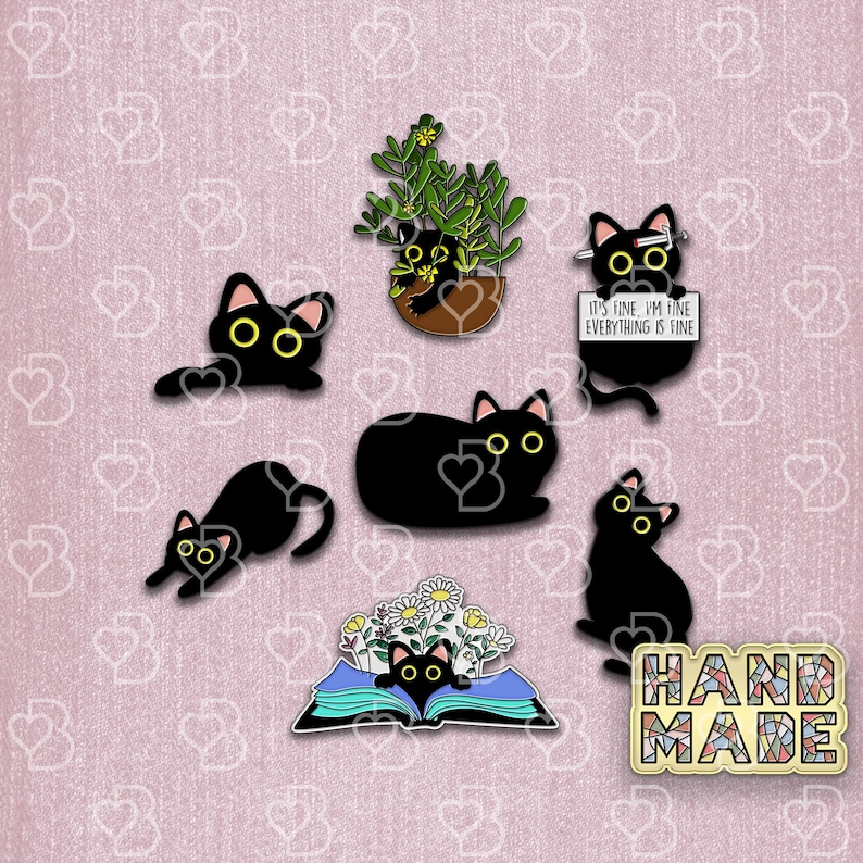 May include: A set of black cat enamel pins with various designs, including a cat in a pot plant, a cat reading a book, a cat with a sign that says "It's fine, I'm fine, everything is fine", and a cat with a flower crown. The pins are on a pink background with a "Handmade" sign.
