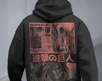 May include: Black hoodie featuring a red and black graphic design from the anime series Attack on Titan. The design includes Japanese text and illustrations of characters and scenes from the show. The hoodie has a drawstring hood and a kangaroo pocket.