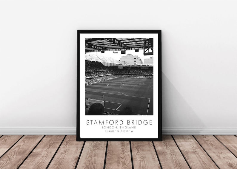 May include: Black and white photograph of Stamford Bridge, a football stadium in London, England. The photo shows the pitch and stands from a high angle. The text "STAMFORD BRIDGE" and "LONDON, ENGLAND" is printed below the image.