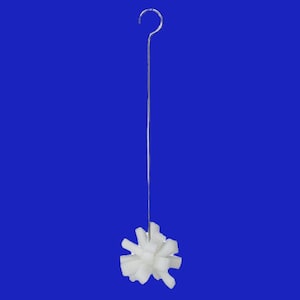 May include: A white bottle cleaning brush with a long, silver handle and a hook at the top.