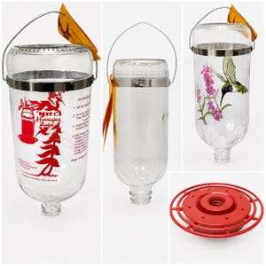 May include: Three clear glass hummingbird feeder components including two inverted bottle reservoirs with metal hanging wires and one red circular plastic base. One bottle features red printed text and graphics, while the other displays a hummingbird illustration.