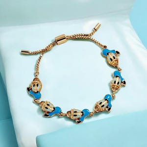 NYTT Disney Kalle Anka-armband med upprepande mönster. Officiellt licensierat Disney. Nytt med etiketter.