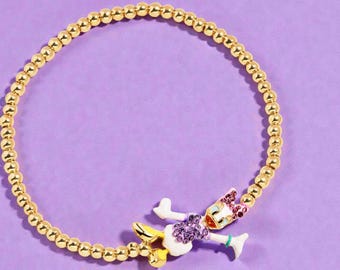 Pulsera elástica de latón bañado en oro de Disney Daisy Duck Pisa con detalles en 3D. Nueva con etiquetas. Producto con licencia oficial de Disney.