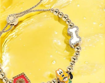 NUEVA pulsera con dije de Disney Pluto Pisa Producto Disney con licencia oficial Nuevo con etiquetas