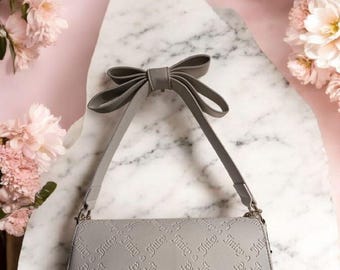 NEW Juicy Couture Miss Bow Crossbody Bag Color Beige 10"W x 6"H x 3" New with tags