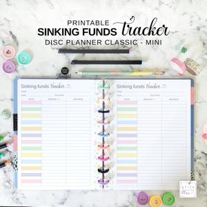 May include: A printable sinking funds tracker for a disc planner, featuring two open pages with columns for date, amount, and balance. The pages have pastel-colored rows and the text Sinking funds tracker. Includes loose disc rings and pens.