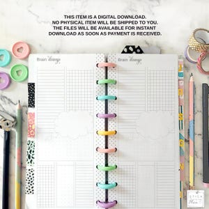 May include: A planner with a dotted spine and colorful disc binding. The planner pages are white with grid and lined sections. The text "Brain Dump" is visible. Decorative pencils, washi tape, and heart-shaped paper clips surround the planner.
