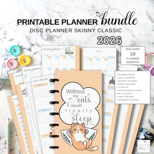 May include: A printable planner bundle with the text "PRINTABLE PLANNER bundle DISC PLANNER SKINNY CLASSIC 2026". The planner includes 10 inserts, a monthly and weekly planner, and a "To Do List". The cover features a cat illustration and the text "Without my cats... I would finally sleep".