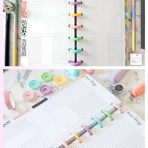 May include: Printable Brain Dump disc planner, 4.125" x 9.25", with a grid and cloud-shaped areas for notes. The planner is held together with colorful disc binding. Accessories include pens, washi tape, and heart-shaped paper clips.