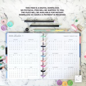 May include: A 2026 calendar planner with a disc-bound spine, featuring twelve monthly grids from January to December. The text reads: THIS ITEM IS A DIGITAL DOWNLOAD. NO PHYSICAL ITEM WILL BE SHIPPED TO YOU. THE FILES WILL BE AVAILABLE FOR INSTANT DOWNLOAD AS SOON AS PAYMENT IS RECEIVED.