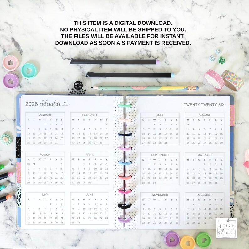 May include: A 2026 calendar planner with a disc-bound spine, featuring twelve monthly grids from January to December. The text reads: THIS ITEM IS A DIGITAL DOWNLOAD. NO PHYSICAL ITEM WILL BE SHIPPED TO YOU. THE FILES WILL BE AVAILABLE FOR INSTANT DOWNLOAD AS SOON AS PAYMENT IS RECEIVED.