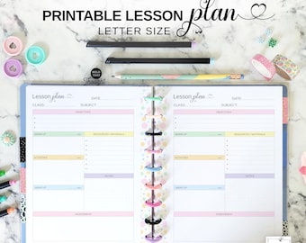May include: Open lesson plan notebook with pastel color-coded sections. The cover reads "PRINTABLE LESSON PLAN LETTER SIZE." Includes pencils, decorative tape, and colorful discbound rings. The notebook is designed for class planning.