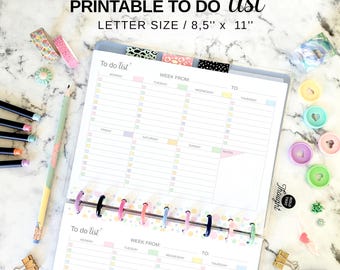 May include: A printable to-do list planner with a letter size of 8.5" x 11". The planner features a colorful design with sections for each day of the week, and includes decorative washi tape, pencils, and binder clips.