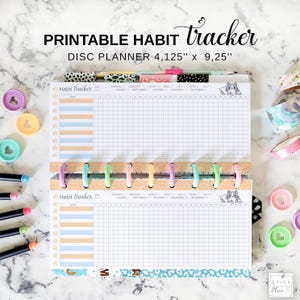 May include: A printable habit tracker disc planner with the text "PRINTABLE HABIT tracker DISC PLANNER 4.125" x 9.25"". The planner has a grid layout for tracking habits, with colorful dividers and a cat illustration. The planner is open, showing the inside pages.
