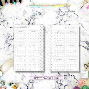 May include: Two white planner calendar inserts for 2026, featuring a black grid layout for each month from January to December. The pages have a dotted border on the outer edges and the text 2026 calendar and TWENTY TWENTY-SIX printed at the top.
