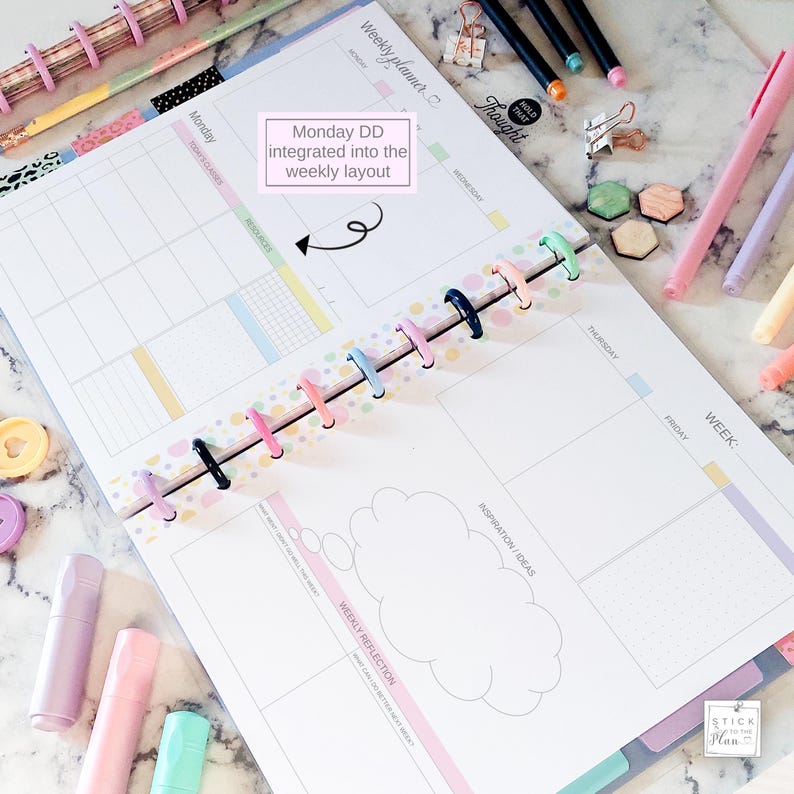May include: Open weekly planner with colorful dividers and spiral binding. The planner features sections for each day of the week, with space for notes and reflections. Text on the page includes "Weekly planner", "Monday", and "Inspiration/Ideas".