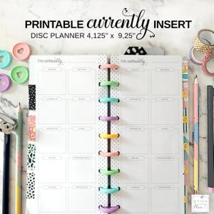 May include: A printable disc planner insert with the text "PRINTABLE currently DISC PLANNER 10.5cm x 23.5cm INSERT". The planner has a dotted spine with colourful disc rings and a "I'm currently..." section with blank spaces for notes. Accessories include pencils and washi tape.